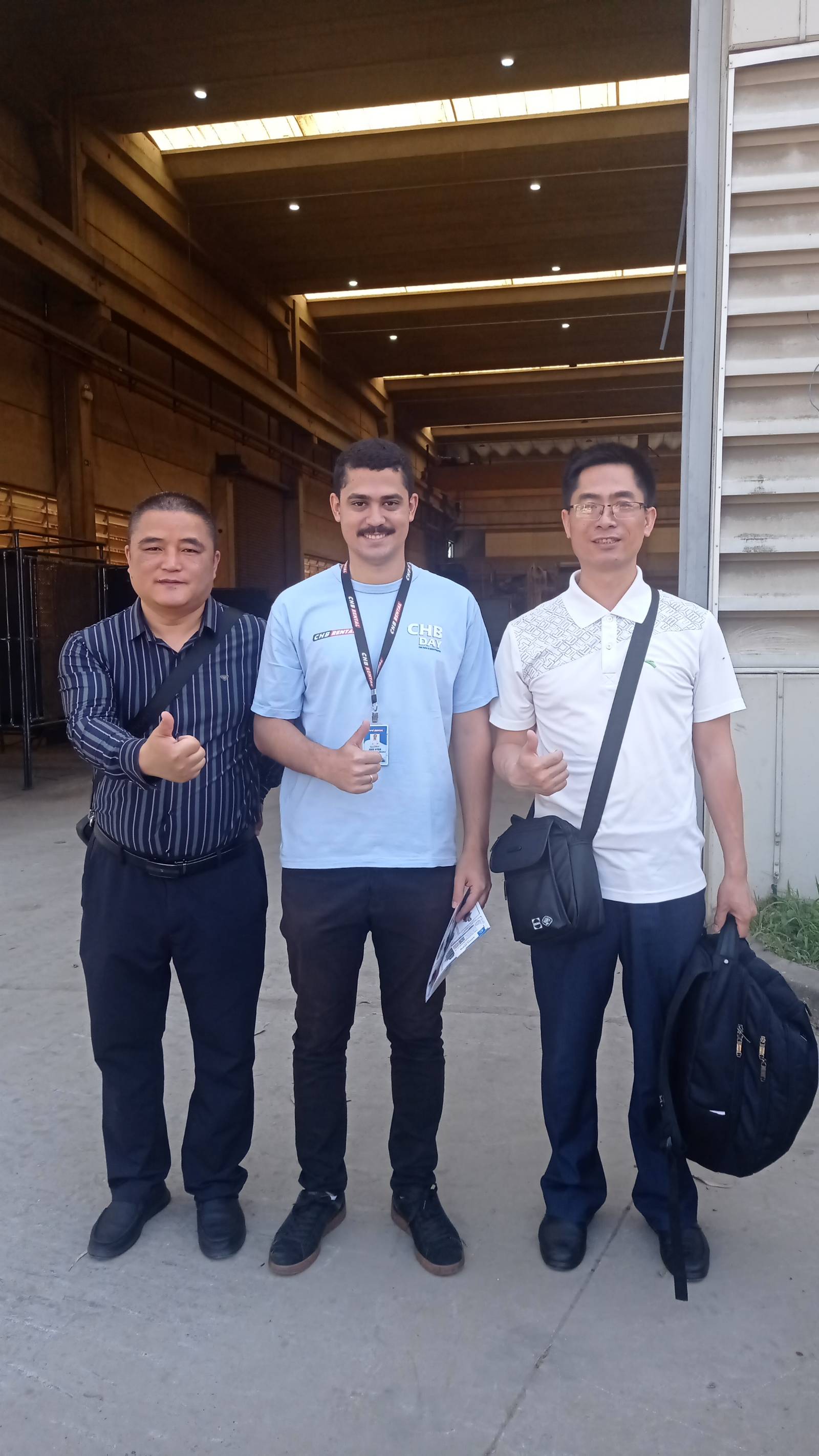 Two of our team with a customer from the Middle East outside the factory after a factory inspection visit